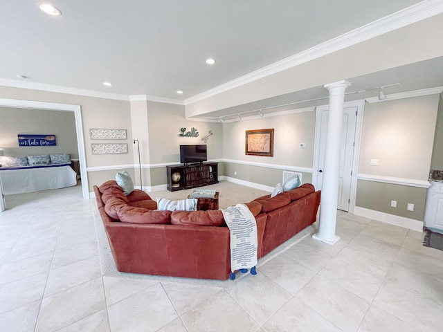 living area with ornate columns, rail lighting, ornamental molding, and recessed lighting