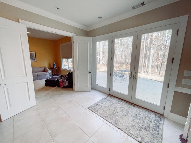 doorway featuring french doors, visible vents, crown molding, and light tile patterned floors