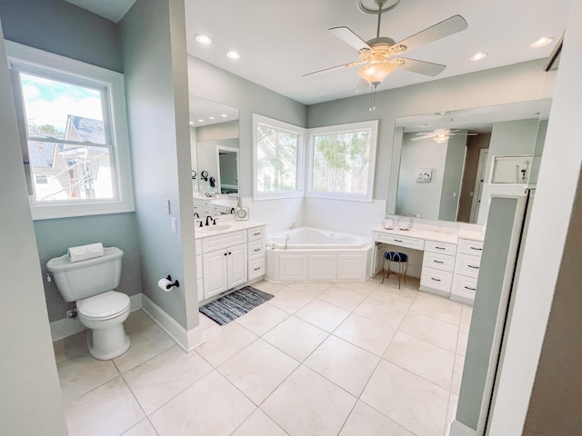 bathroom featuring tile patterned flooring, a wealth of natural light, and vanity