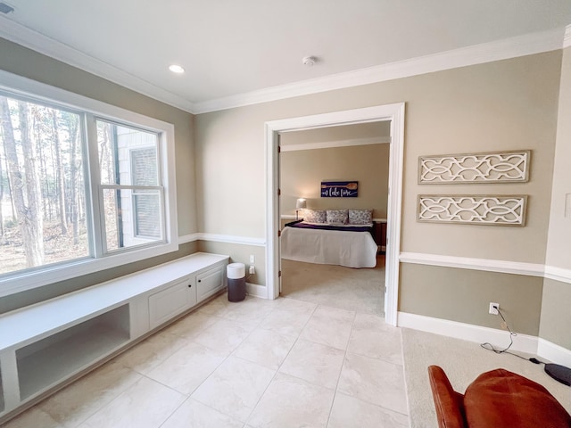 bathroom with tile patterned flooring, crown molding, baseboards, and recessed lighting