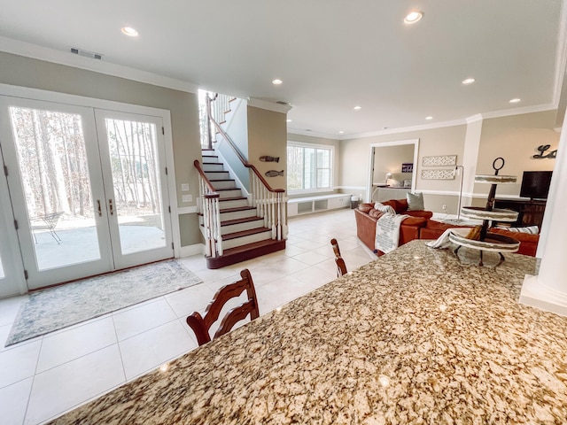 dining room with light tile patterned floors, visible vents, ornamental molding, stairs, and recessed lighting