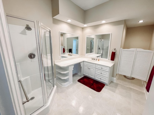 full bath featuring recessed lighting, a shower stall, vanity, and tile patterned floors