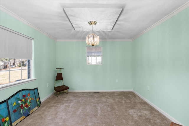 carpeted spare room featuring crown molding and a chandelier