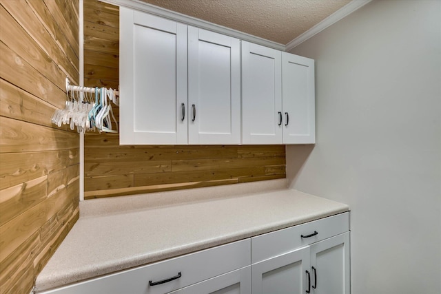 213 Oak Ln, Waynesboro, GA 30830 - detailed view of wooden walls, crown molding, and a textured ceiling