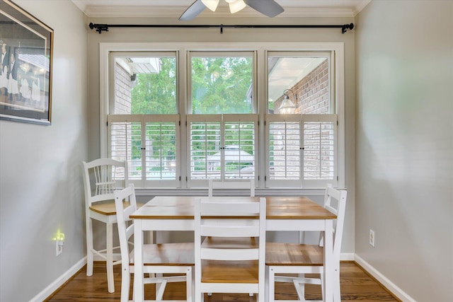 213 Oak Ln, Waynesboro, GA 30830 - dining space with crown molding, baseboards, ceiling fan, and wood finished floors