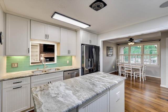 213 Oak Ln, Waynesboro, GA 30830 - kitchen with fridge with ice dispenser, a sink, dishwasher, baseboards, and decorative backsplash