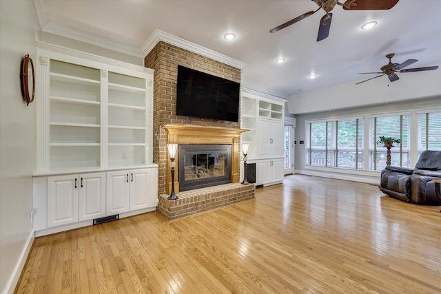 213 Oak Ln, Waynesboro, GA 30830 - unfurnished living room with a ceiling fan, light wood finished floors, ornamental molding, built in features, and a brick fireplace