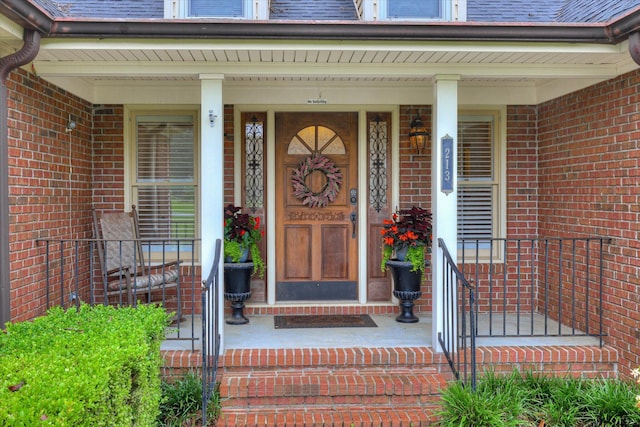 213 Oak Ln, Waynesboro, GA 30830 - view of exterior entry featuring brick siding and covered porch
