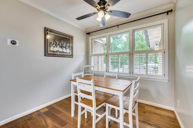 213 Oak Ln, Waynesboro, GA 30830 - dining area featuring crown molding, baseboards, wood finished floors, and a ceiling fan