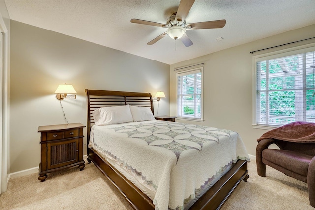 213 Oak Ln, Waynesboro, GA 30830 - bedroom featuring light colored carpet, baseboards, a ceiling fan, and a textured ceiling