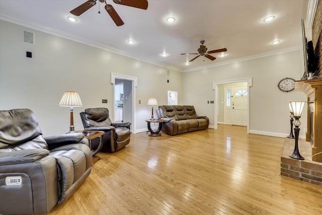 213 Oak Ln, Waynesboro, GA 30830 - living room with a ceiling fan, light wood-type flooring, crown molding, recessed lighting, and a fireplace