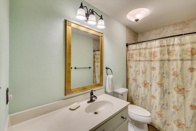 213 Oak Ln, Waynesboro, GA 30830 - full bath featuring toilet, vanity, a textured wall, and curtained shower