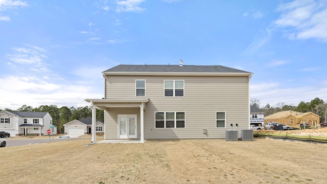 rear view of property with cooling unit