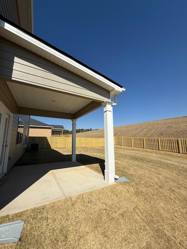 view of yard featuring a patio and fence