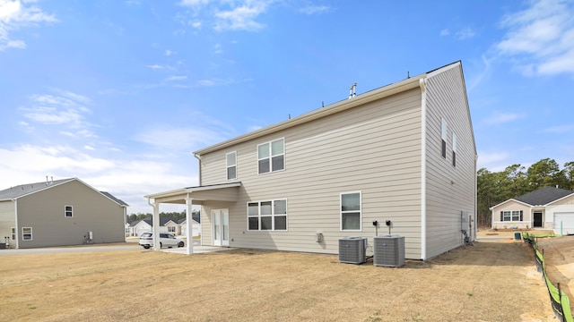 back of house featuring cooling unit