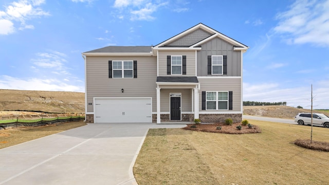 view of front facade featuring a garage and a front lawn