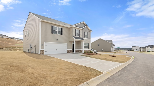 view of front of home featuring an attached garage and concrete driveway