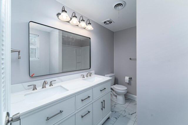 bathroom featuring vanity and toilet