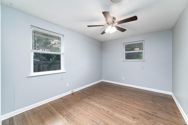 unfurnished room featuring hardwood / wood-style floors and ceiling fan