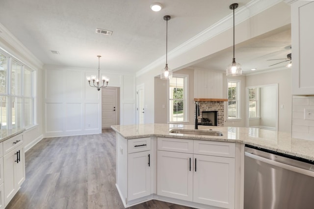 1086 Birdie Pl, Graniteville, SC 29829 - kitchen featuring stainless steel dishwasher, white cabinets, a sink, visible vents, and ornamental molding
