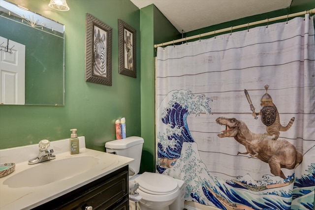 bathroom with a shower with curtain, vanity, toilet, and a textured ceiling