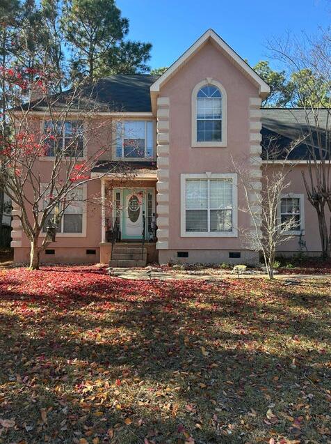 view of front of home featuring a front yard