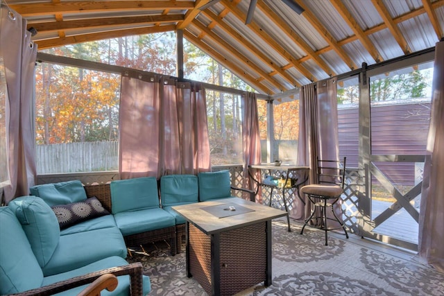 sunroom featuring vaulted ceiling