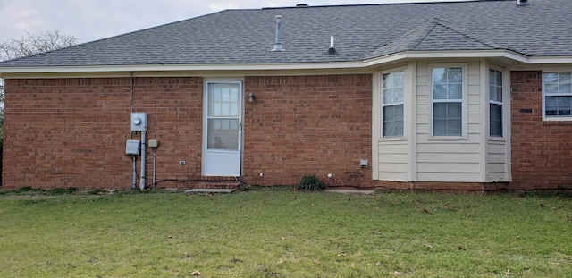 back of house with a yard