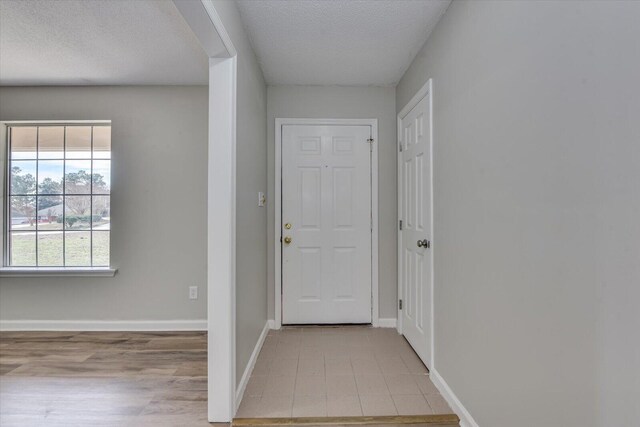 kitchen featuring white cabinets, dishwasher, dark wood-type flooring, sink, and ornamental molding