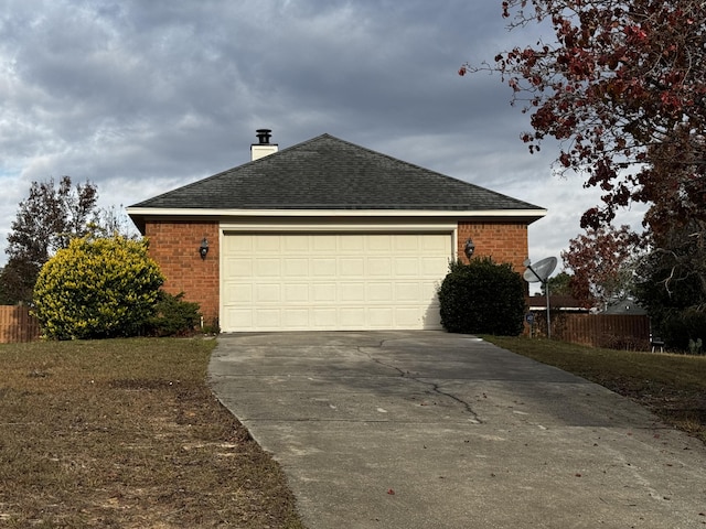 view of side of home featuring a garage