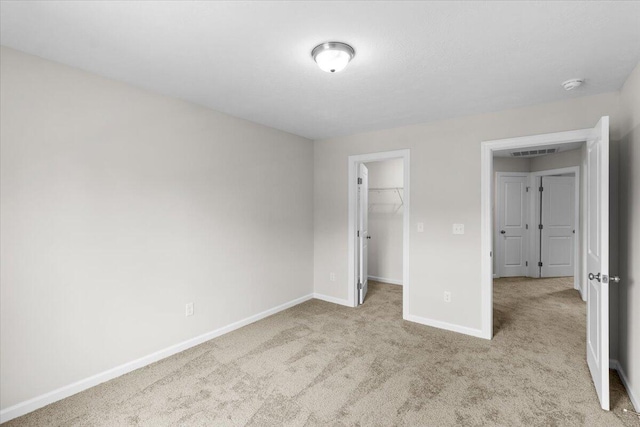 250 Prominence Dr, Grovetown, GA 30813 - unfurnished bedroom with carpet flooring, a spacious closet, and a closet