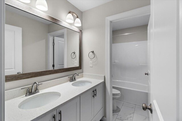 250 Prominence Dr, Grovetown, GA 30813 - bathroom with marble look tiles, double vanity, and shower / bathtub combination