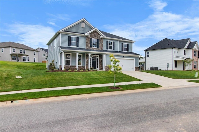 250 Prominence Dr, Grovetown, GA 30813 - craftsman-style house with stone siding, driveway, a front lawn, and an attached garage