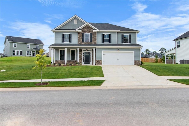 250 Prominence Dr, Grovetown, GA 30813 - craftsman house featuring stone siding, concrete driveway, an attached garage, and a porch