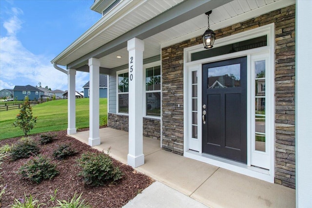 250 Prominence Dr, Grovetown, GA 30813 - property entrance featuring covered porch, stone siding, and a yard