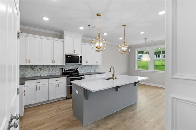 250 Prominence Dr, Grovetown, GA 30813 - kitchen featuring stainless steel appliances, ornamental molding, backsplash, white cabinetry, and light wood-style floors