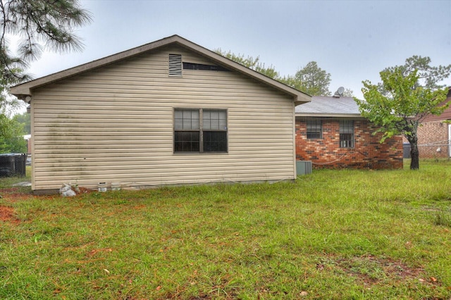 view of property exterior with a lawn