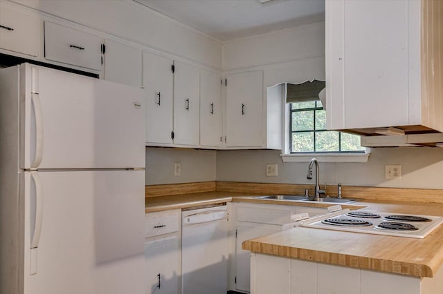 kitchen with sink, white cabinets, white appliances, and wood counters