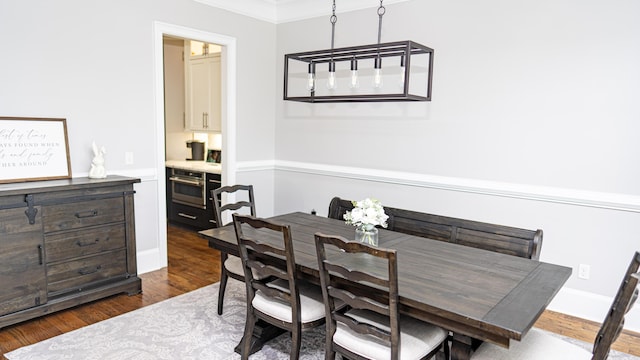 902 Adderley Ln, Evans, GA 30809 - dining space featuring dark wood finished floors and ornamental molding