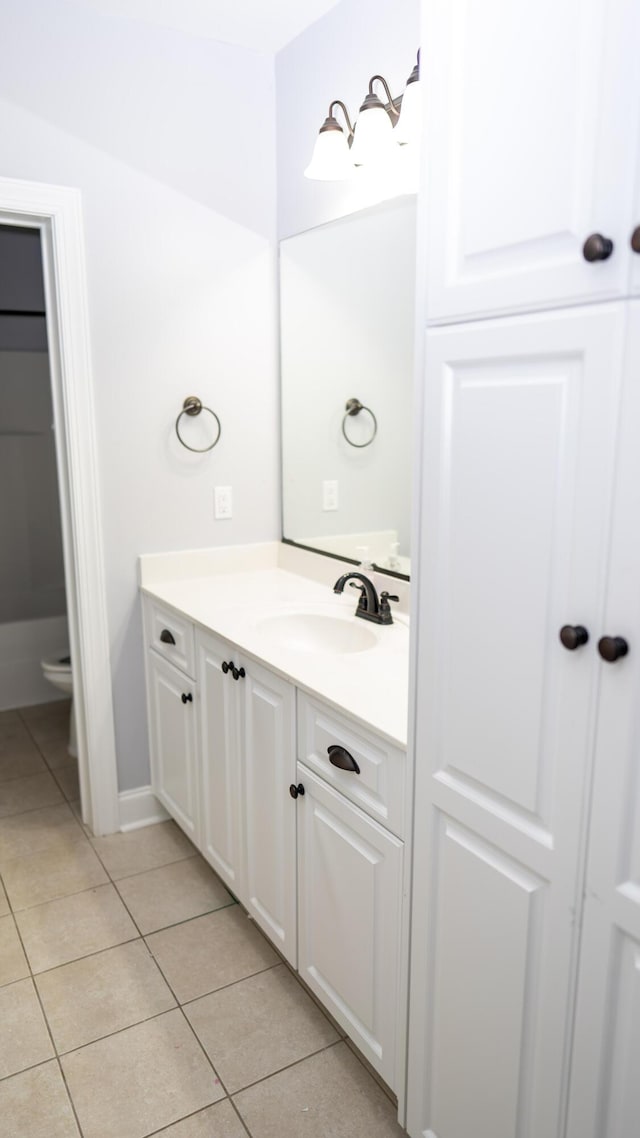 902 Adderley Ln, Evans, GA 30809 - bathroom featuring vanity, tile patterned floors, baseboards, and toilet