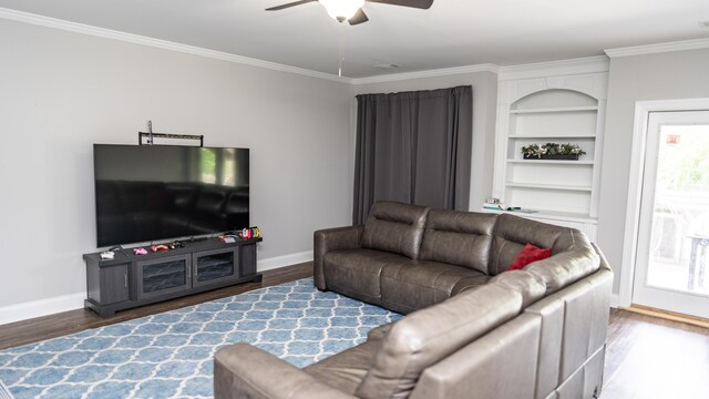 902 Adderley Ln, Evans, GA 30809 - living room with wood finished floors, baseboards, a ceiling fan, ornamental molding, and built in features