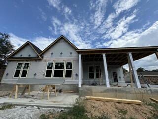 rear view of house featuring a patio area