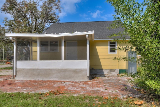 exterior space featuring a sunroom