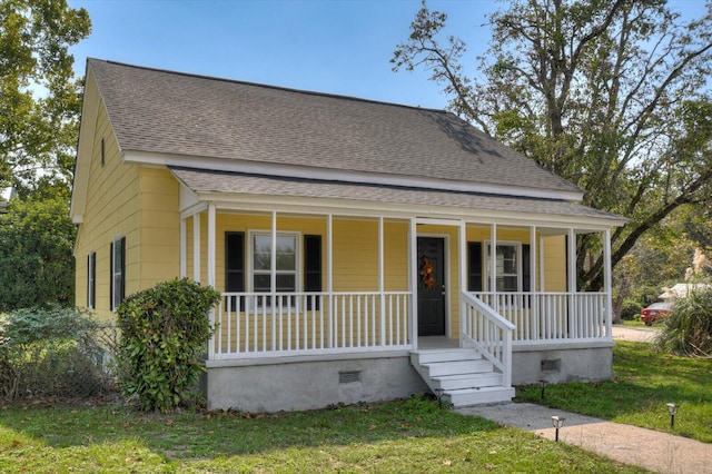 view of front of property with a front yard and a porch