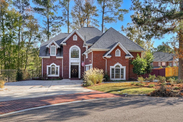 view of front of property with a front lawn and a garage