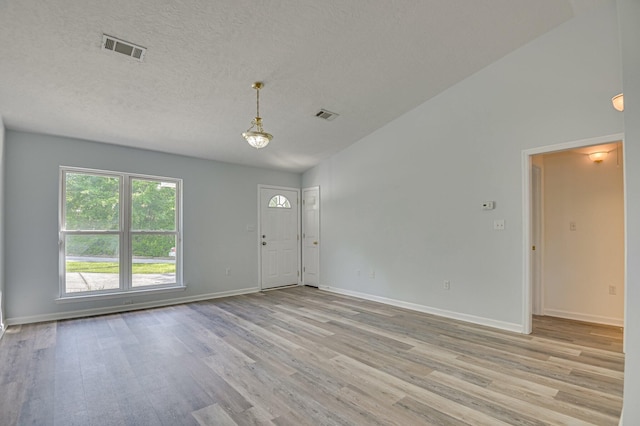 2273 Pund Ave, Augusta, GA 30904 - foyer featuring light wood finished floors, lofted ceiling, and a textured ceiling