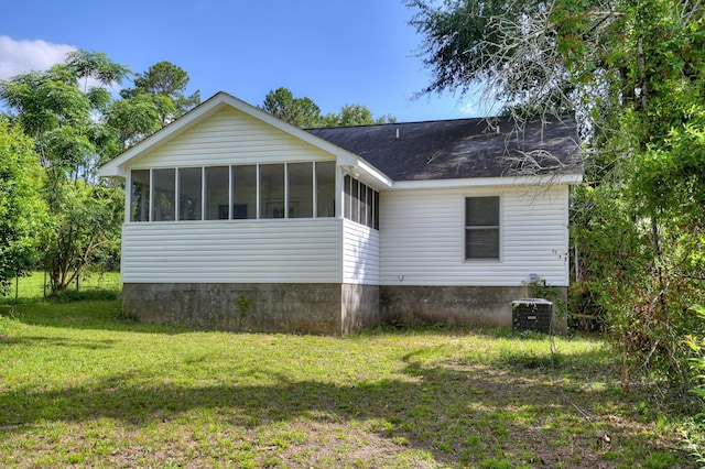 2273 Pund Ave, Augusta, GA 30904 - back of property with a sunroom, a lawn, and a shingled roof