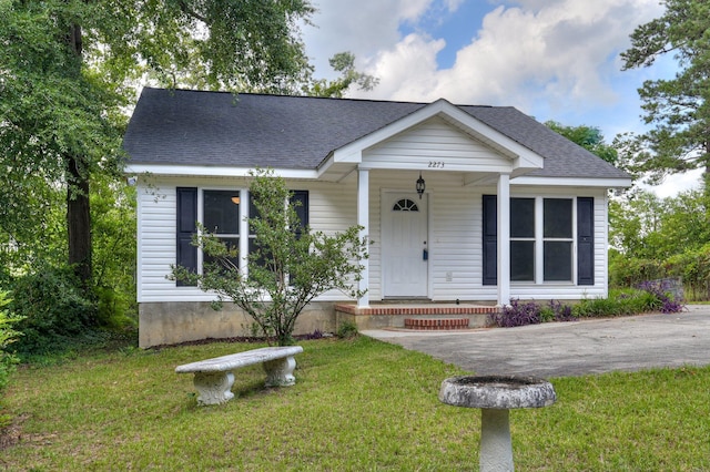 2273 Pund Ave, Augusta, GA 30904 - view of front of house with roof with shingles, a front yard, and a porch
