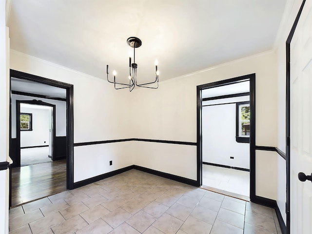 1952 Satcher Blvd, Augusta, GA 30906 - spare room featuring a chandelier, ornamental molding, light tile patterned floors, and baseboards