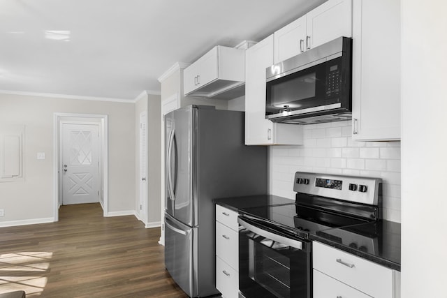 kitchen featuring appliances with stainless steel finishes, dark wood-type flooring, white cabinetry, and crown molding